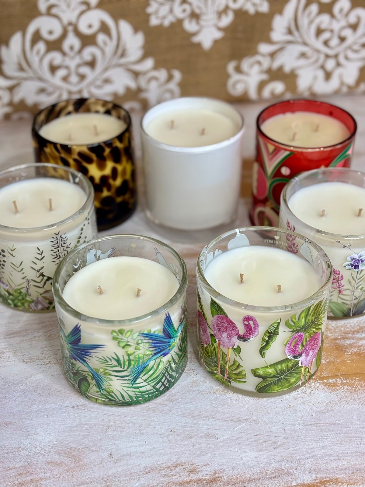 Hand poured soy candles in decorated glass vessels