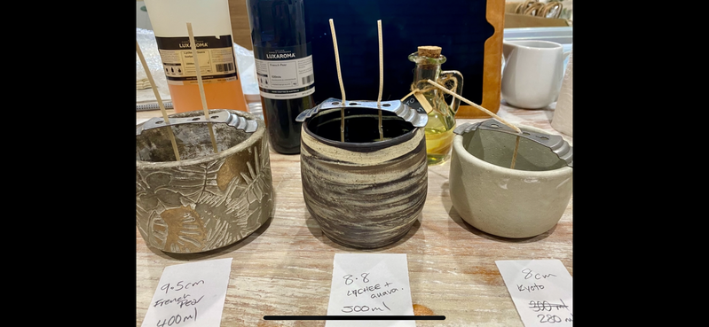 Jars labelled with fragrance names and sizes